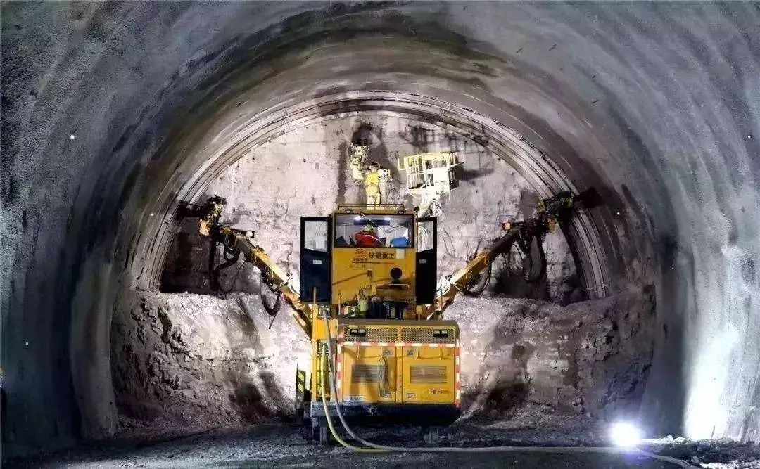 Technology for Reinforcing Tunnel Face Using Three-arm Drilling Rig Combining with Fiberglass Bolt